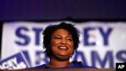 FILE - Democratic candidate for Georgia Governor Stacey Abrams speaks during an election-night watch party, May 22, 2018, in Atlanta. 