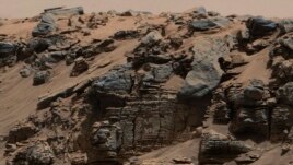Description: An evenly-layered rock on the planet Mars, photographed by the Mast Camera (Mastcam) on NASA's Curiosity Mars Rover is shown in the NASA handout provided December 9, 2014. (REUTERS)