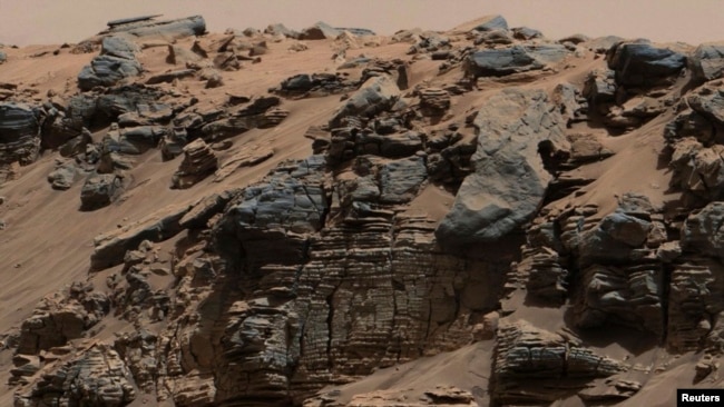 Description: An evenly-layered rock on the planet Mars, photographed by the Mast Camera (Mastcam) on NASA's Curiosity Mars Rover is shown in the NASA handout provided December 9, 2014. (REUTERS)