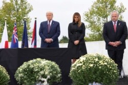 U.S. President Donald Trump and first lady Melania Trump are accompanied by U.S. Secretary of the Interior David Bernhardt as they attend a ceremony at the Flight 93 National Memorial, remembering those killed when hijacked Flight 93 crashed into an open field on September 11, 2001, in Stoystown, Pennsylvania, September 11, 2020. REUTERS/Jonathan Ernst