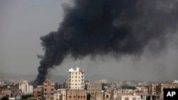 FILE - Smoke rises after Saudi-led coalition airstrikes in Sana'a, Yemen, Aug. 9, 2016. The coalition is now hoping to gain control of a number of Red Sea ports, key among them the port of Hodeida.