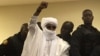 Chad's former dictator Hissene Habre raises his hand during court proceedings in Dakar, Senegal, May 30, 2016. 