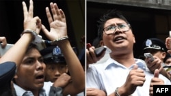 Les journalistes Kyaw Soe Oo et Wa Lone, après leur condamnation par un tribunal de prison à Yangon, le 23 avril 2019. (Photo de Ye Aung THU / AFP)