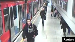 In this CCTV image released by the London Metropolitan Police, showing Lee Rigby of the Royal Regiment of Fusiliers (L), in this photo dated May 22, 2013, at Woolwich DLR rail station in London.