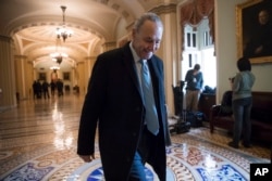 Senate Minority Leader Chuck Schumer, D-N.Y., arrives at the Capitol at the start of the third day of the government shutdown, in Washington, Jan. 22, 2018.