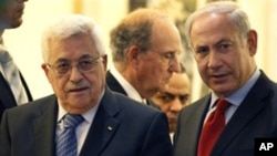 Palestinian president Mahmoud Abbas, left, walks with Israeli Prime Minister Benjamin Netanyahu, right, with Special Middle East Peace Envoy, former Sen. George Mitchell, behind center, in Jerusalem, Wednesday, Sept. 15, 2010.