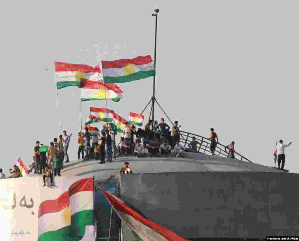 The stadium was packed far beyond capacity, and some locals showed their support from atop a water tower overlooking the rally in Irbil, Kurdistan Region of Iraq, Sept. 22, 2017.
