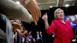 Democratic presidential candidate Hillary Clinton, center, arrives to speak at a get out the vote event at Transylvania University in Lexington, Kentucky, May 16, 2016. 