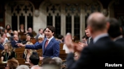 Le premier ministre du Canada, Justin Trudeau, prend la parole à la Chambre des communes sur la Colline du Parlement à Ottawa (Ontario), le 9 mai 2018. Les législateurs ont condamné lundi à l'unanimité les attaques personnelles contre Trudeau par le président américain Donald Trump et le White Hou.