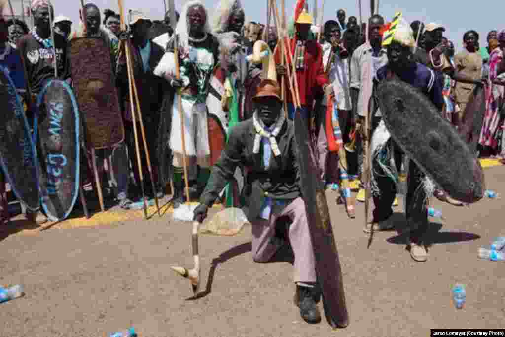 South Sudanese celebrate the resumption of oil production at Paloch oil field, the new nation's largest facility, on Sunday, May 5, 2013.
