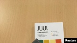 FILE - A Juul e-cigarette starter pack is seen July 16, 2018.