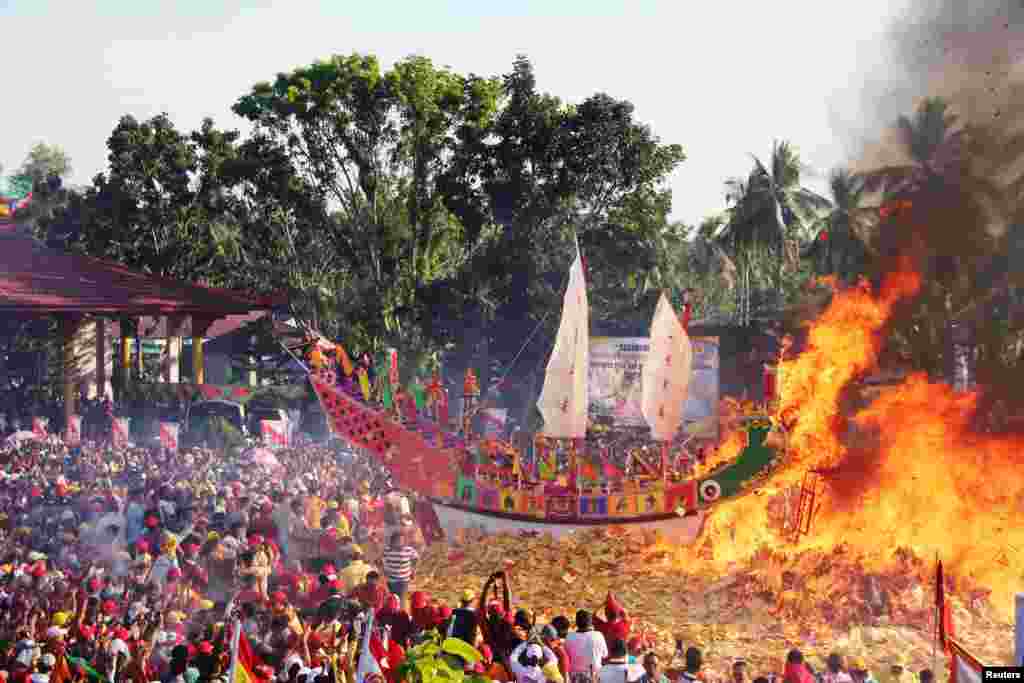 Konghucu worshippers attend the Bakar Tongkang ritual in Bagansiapiapi, Riau province, Indonesia, in this picture taken by Antara Foto.