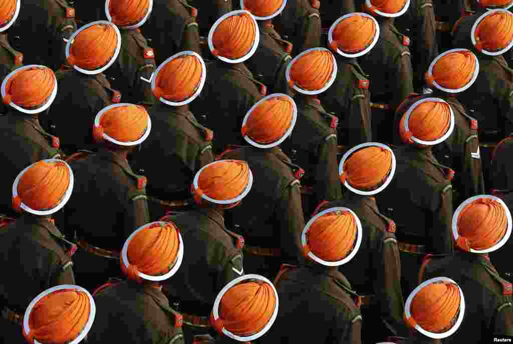 Indian Army soldiers march during the full dress rehearsal for the Republic Day parade in New Delhi.