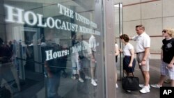 FILE - In this June 12, 2009 file photo, people line to enter the U.S. Holocaust Memorial Museum in Washington. The U.S. museum is requesting that smartphone users refrain from "catching" Pokemon when they are inside the museum