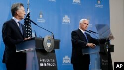 U.S. Vice President Mike Pence, right, and Argentina's President Mauricio Macri attend a news conference at the government residence in Buenos Aires, Argentina, Aug. 15, 2017. 