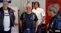 Daniel Baud, second from left, and members of the Bastille Harley owners group. (L. Bryant/VOA)