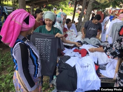 T-shirts printed with Cambodia's Cham alphabets are for sale. According to community members, Cham language and script learning has declined due in part to a lack of its inclusion in formal school curriculum in Cambodia. (Courtesy photo of Leb Ke)