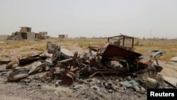 Military vehicle wreckage belonging to Islamic State militants is seen in Falluja, Iraq, June 18, 2016.