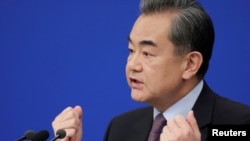 Chinese Foreign Minister Wang Yi attends a news conference on the sidelines of the National People's Congress, China's parliamentary body, in Beijing, March 8, 2019.