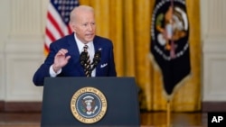 President Joe Biden speaks during a news conference in the East Room of the White House in Washington, Jan. 19, 2022. 