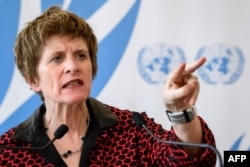 FILE - United Nations Deputy High Commissioner for Human Rights, Kate Gilmore, gestures while delivering a statement during the U.N. Human Rights Council session in Geneva, Switzerland, March 13, 2018.