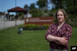 Transgender U.S. Army captain Jennifer Sims poses at the main gate of the Joint Multinational Readiness Center after an interview with The Associated Press in Hohenfels near Regensburg, Germany, July 29, 2017.