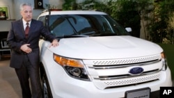 FILE - Ford Japan Chief Executive Timothy Tucker introduces the new Ford Explorer in Tokyo, May 24, 2011. Automaker Ford Motor Co. said Jan. 25, 2016, it will close all operations in Japan and Indonesia this year.