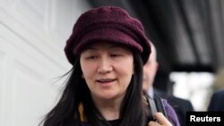 FILE - Huawei Technologies Chief Financial Officer Meng Wanzhou arrives at her home after her court appearance in Vancouver, British Columbia, March 6, 2019.