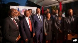 Haiti's Prime Minister Ariel Henry, center, is pictured with the new members of his cabinet, in Port-au-Prince, Haiti, Nov. 24, 2021.