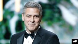 U.S. actor George Clooney speaks on stage prior to receiving an Honorary Cesar award during the ceremony of 42nd Cesar Film Awards, at the Salle Pleyel, in Paris, France, Feb. 24, 2017. 