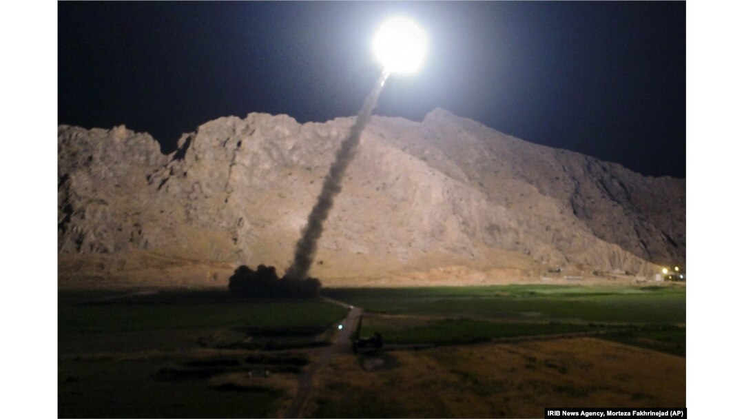 FILE - A missile is fired from city of Kermanshah, in western Iran, targeting the Islamic State group in Syria, June 19, 2017.