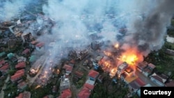 ချင်းပြည်နယ်၊ ထန်တလန်မြို့ မီးလောင်နေတဲ့မြင်ကွင်း။ (ဓာတ်ပုံ - CHRO)