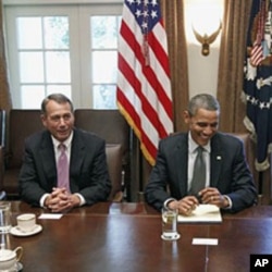 President Barack Obama sits with House Speaker John Boehner of Ohio (L), as he met with Republican and Democratic leaders regarding the debt ceiling, at the White House (File Photo - July 14, 2011)