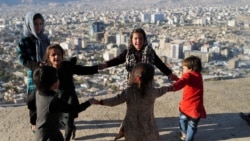 Children play outside their house at Tv mountain in Kabul, Afghanistan October 15, 2021. (REUTERS/Zohra Bensemra)