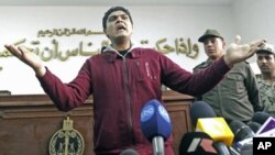Army doctor Ahmed Adel, who was accused of carrying out a forced virginity test on a female detainee, speaks to the media after being acquitted, in Cairo, Egypt, March 11, 2012.