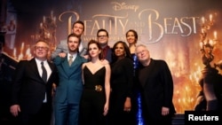  Director Bill Condon and composer Alan Menken pose with cast members Dan Stevens, Luke Evans, Emma Watson, Josh Gad, Audra McDonald and Gugu Mbatha-Raw at the premiere of "Beauty and the Beast" in Los Angeles, March 2, 2017. 