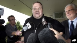 FILE - Kim Dotcom, the founder of the file-sharing website Megaupload, comments after he was granted bail and released in Auckland, New Zealand, Feb. 22, 2012.