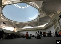 FILE - Muslims pray in Strasbourg mosque in eastern France, Aug. 1, 2011.