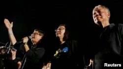 FILE - Founders of the Occupy Central civil disobedience movement, from left, Chan Kin-man, Benny Tai and Chu Yiu-ming, attend a campaign to kick off the movement in Hong Kong, Aug. 31, 2014. 