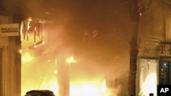 Store blazes fiercely during looting in the Woolwich district of southeast London August 9, 2011