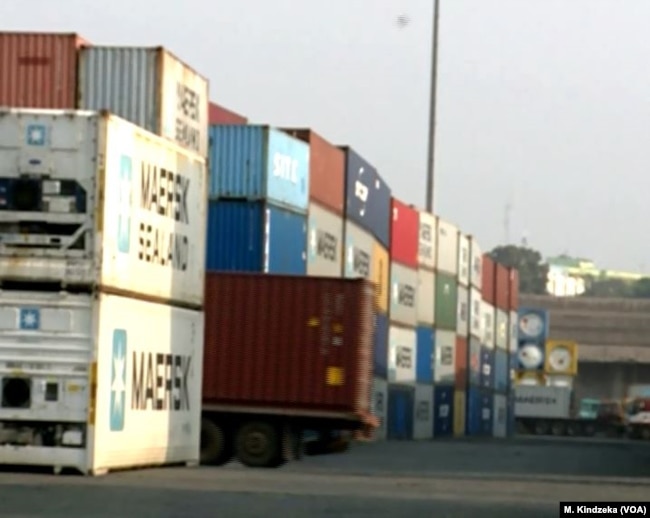 Shipping containers are stacked up, Jan. 10, 2019, at the port of Douala, Cameroon.