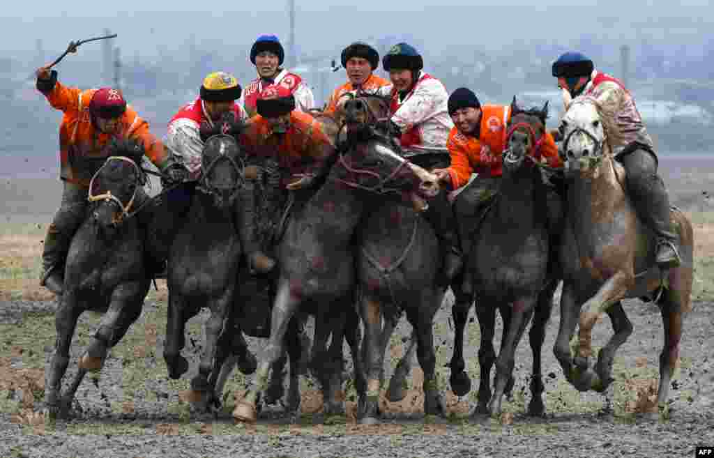 Kyrgyz riders play the traditional Central Asian sport of Kok-Boru (Gray Wolf) or Buzkashi (Goat Grabbing) in the village of Sokuluk, some 20 kilometers from Bishkek, Kyrgyzstan.