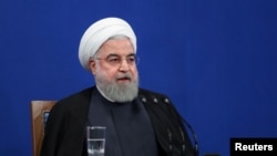 Archivo - El presidente iraní, Hassan Rouhani, habla durante conferencia de prensa en Teherán, Irán, el 14 de octubre de 2019. 