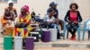 Polling officials wait at the local IEC (Independent Electoral Commission) headquarters to distribute the ballot boxes to the polling stations, in Serekunda, Gambia, Nov. 29, 2016.