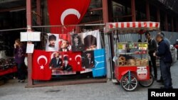 FILE - A street vendor sells baked products in Istanbul, Turkey, Nov. 8, 2017. Turkey’s jobless rate has surged to 13.5 percent, the highest since 2010.