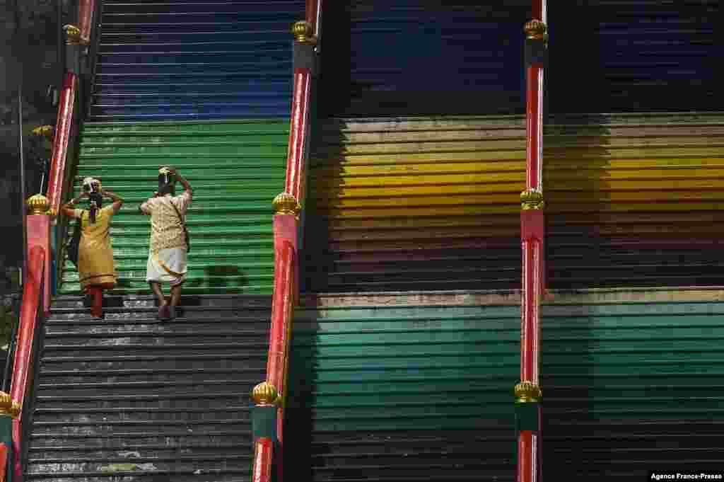 Hindu devotees carry &quot;Paal Kudam&quot; (milk pots) ahead of the Thaipusam festival in Kuala Lumpur, Malaysia.