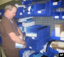 Toyota developed the Kanban system to keep supplies stocked and organized. Each blue bin is divided in the middle. When one half is empty, it signals the staff to reorder supplies.