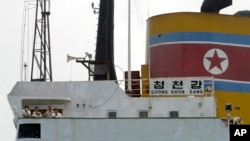 North Korean sailors stand on the deck of the North Korean-flagged cargo ship Chong Chon Gang in Sherman Bay near Colon City, Panama, February 12, 2014. 