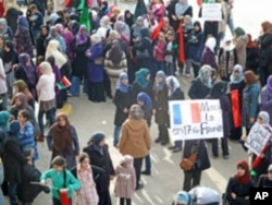 At a woman's rally in Benghazi, Libya, supporters show their appreciation that France has recognized the Transitional Council as the legitimate representative of the Libyan people, March 10, 2011