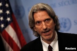 FILE - Rights activist John Prendergast speaks to reporters after briefing the U.N. Security Council during a meeting on maintenance of international peace and security at U.N. headquarters in New York, Sept. 10, 2018.